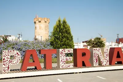 a large sign in front of a building with a tower at BONITA CASA CUEVA CON JACUZZI in Paterna