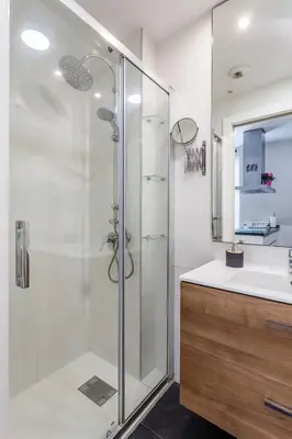 a bathroom with a shower and a sink at Piso en la Playa, Wifi gratis y AC in Valencia
