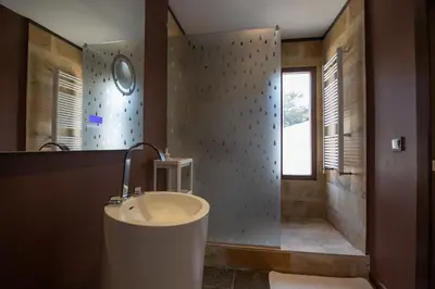 a bathroom with a sink and a shower at Villa Huerta 2, Paterna, jacuzzi, sauna in Paterna