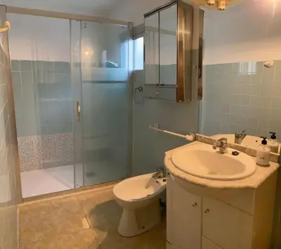 a bathroom with a sink and a shower and a toilet at Casa en Puerto de Sagunto. Playa in Canet de Berenguer
