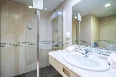a bathroom with a sink and a shower at Hotel Beleret in Valencia