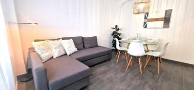 a living room with a couch and a table at Dionis Silence in Valencia