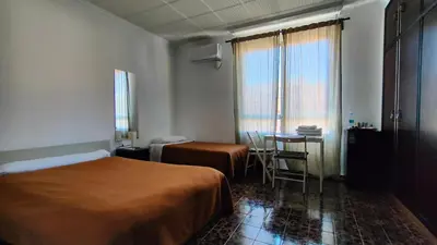 a hotel room with a bed and a table at Pensión Benavente AP-7 3min coche Playa 5 min Self check-in 24h in Moncófar