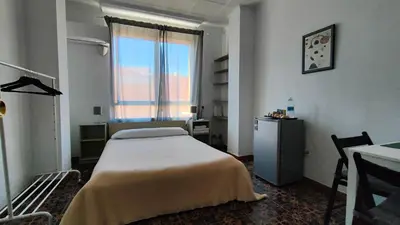 a hospital room with a bed and a window at Pensión Benavente AP-7 3min coche Playa 5 min Self check-in 24h in Moncófar