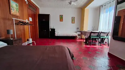 a room with a bedroom with a table and chairs at Pensión Benavente AP-7 3min coche Playa 5 min Self check-in 24h in Moncófar