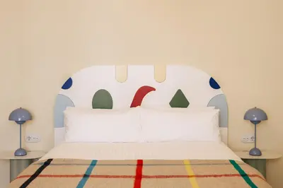 a bedroom with a bed with a headboard at Casa Clarita in Valencia