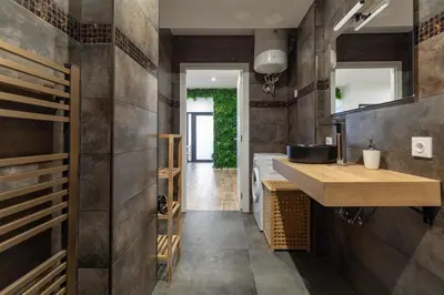 a bathroom with a sink and a toilet and a shower at ApartUP Ruzafa Vertical in Valencia