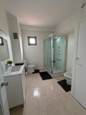 a bathroom with a glass shower and a toilet at Appartement Célia in Algemesí