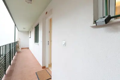 a hallway of a building with a hallway at Adorable apartment 60m from the beach by Hometels in Puerto de Sagunto