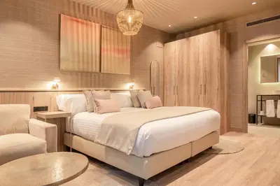 a bedroom with a bed and a table and a couch at The Valentia Corretgería in Valencia