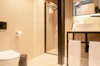 a bathroom with a toilet and a shower at The Valentia Corretgería in Valencia