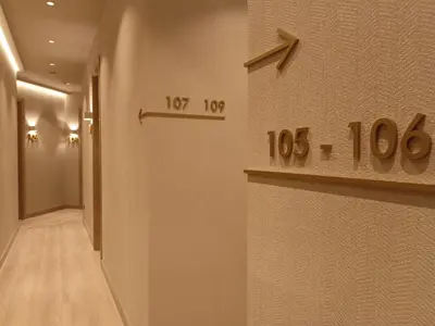 a hallway with a clock on the wall at The Valentia Corretgería in Valencia