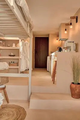 a hallway with a staircase in a house with a door at Suite con Jacuzzi en la montaña. in Llombay