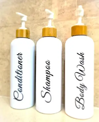 three bottles of hand sanitizer sitting on a table at BEACH VALENCIA LUXURY B40-7 Apartament on Beach in Valencia