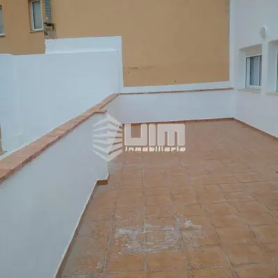 a staircase in a room with a brick floor at UIM Mediterraneo ATICO Hispanidad 3 Wifi in Puerto de Sagunto