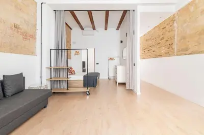 a living room with a couch and a table at PR27 in Valencia