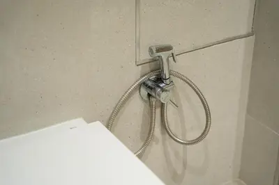 a shower in a bathroom with a shower head at Mimi's Apartment in En Corts in Valencia