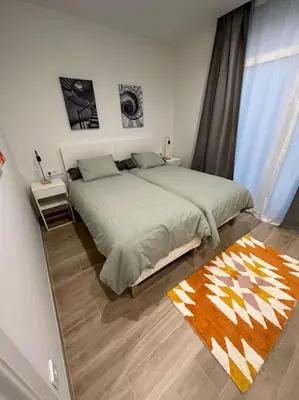 a bedroom with a large bed and a large window at Precioso apartamento con patio. PYP in Valencia