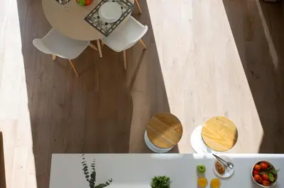 an overhead view of a table and two tables and chairs at SingularStays Arena in Valencia
