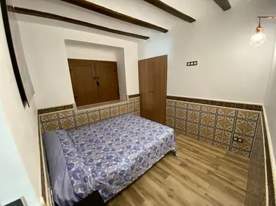 a bedroom with a bed in a room at La Carchata in Siete Aguas