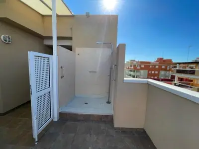 a bathroom with a shower stall on a building at Apartamento Grao de Moncofar REF. 041 in Moncófar