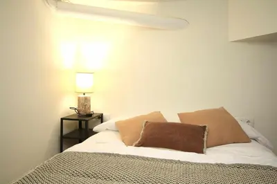 a bedroom with a bed with two pillows on it at Loft Ibiza Apartamento n2 in Valencia
