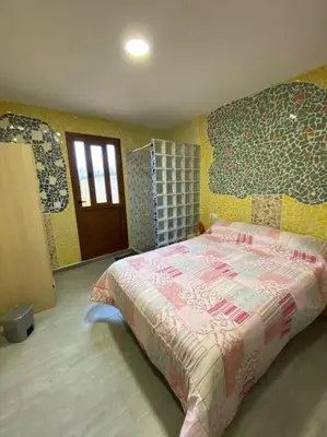 a bedroom with a large bed in a room at LA CASONA in Siete Aguas