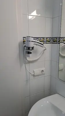 a row of blue and white vases on a wall at Habitación familiar Portalet in Benaguacil
