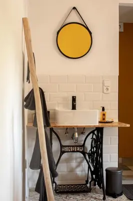 a bathroom with a sink and a mirror on the wall at Casa Mas Montañas in Godelleta