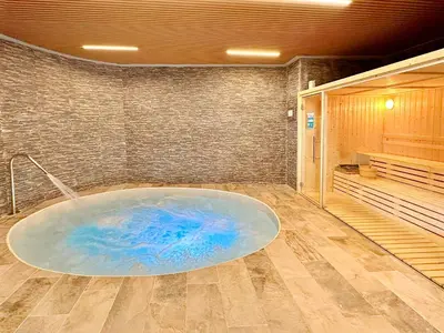 a bathroom with a large tub in a room at Moderno apartamento con vistas a la costa mediterranea en Gran Canet in Canet de Berenguer