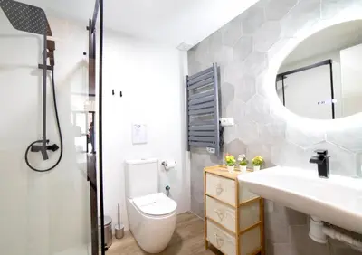 a bathroom with a sink toilet and a mirror at B2 Verdeguer - Cozy Loft close to the beach in Valencia