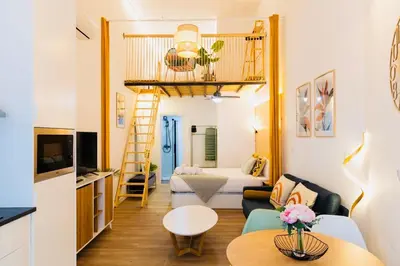 a living room with a loft bed in a room at B2 Verdeguer - Cozy Loft close to the beach in Valencia