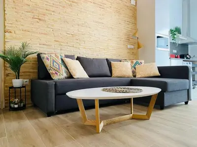 a living room with a couch and a coffee table at B3 Verdeguer - Cozy Loft Close to the Beach in Valencia