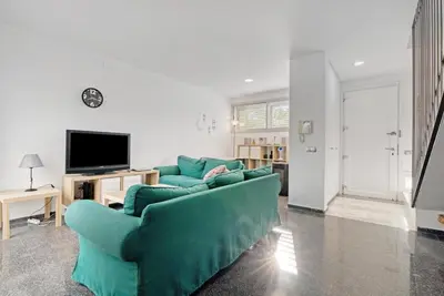 a living room with a blue couch and a tv at Sagunto - Albalat de Tarongers - Estivella - Gilet in Albalat de Taronchers