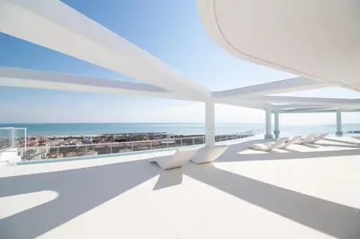 a view of the ocean from the balcony of a building at Global Vacacional, Apartamento para 5 personas con terraza in Canet de Berenguer