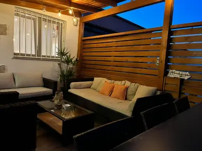 a living room with a couch and a table at Casa en primera linea de playa in Puzol