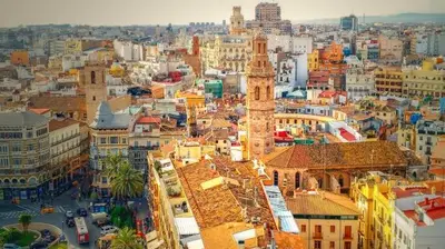 an aerial view of a city with a clock tower at Urban Beach in Valencia