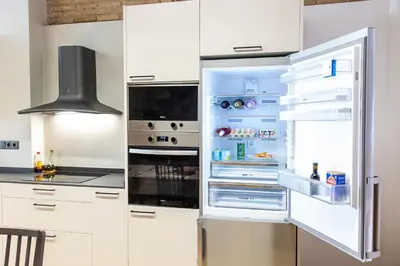 a refrigerator with its door open in a kitchen at Maritime House Valencia Beach in Valencia