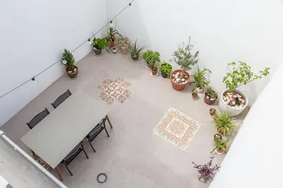 an overhead view of a table and potted plants at Maritime House Valencia Beach in Valencia