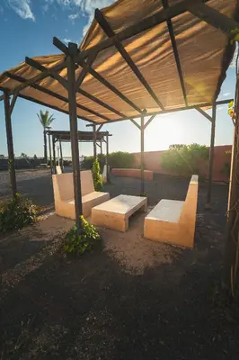 a picnic shelter with benches and a skate park at HolaCamp Chilches in Xilxes