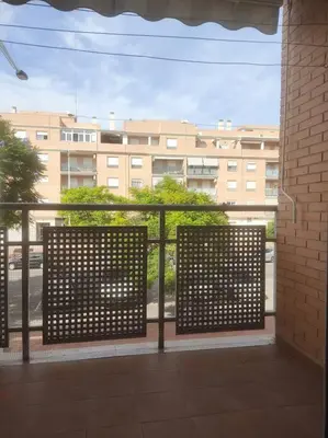 a view of a building from a balcony at Precioso apartamento en Puerto de Sagunto Valencia in Puerto de Sagunto