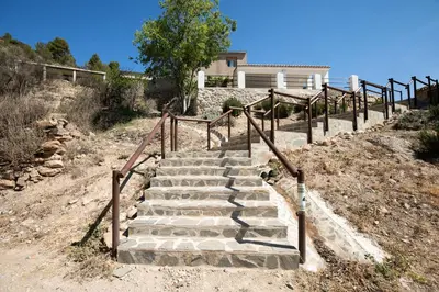 a set of stairs in front of a house at Casa Rural Lavadero en Teresa in Ríos de Abajo