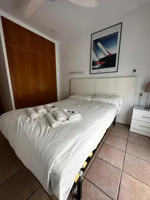 a bedroom with a white bed with towels on it at Zerka Ayuntamiento in Valencia