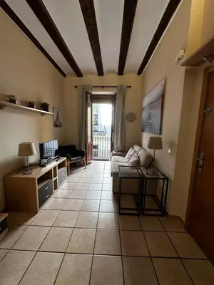 a living room with a couch and a table at Zerka Ayuntamiento in Valencia