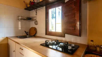 a kitchen with a stove and a sink and a window at Orange Blossom Finca Unique in Valencia