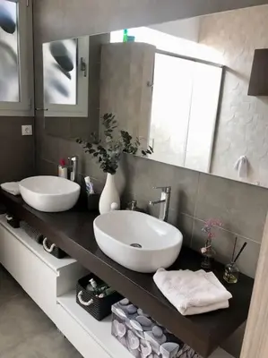 a bathroom with two sinks and a large mirror at Racó de la Mar in Faro de Cullera