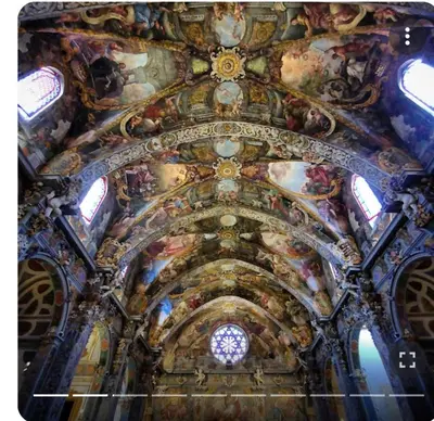 a ceiling of a church with paintings on it at Valencia Centro andando y Playa malvarrosa tranvía in Valencia