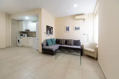 a living room with a couch and a chair at Nest Silence in Valencia