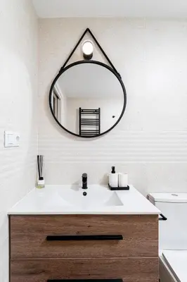 a bathroom with a sink and a mirror at Espectacular piso reformado al lado del rio Turia in Valencia