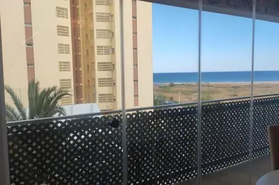 a balcony with a view of the ocean at Playa Puebla de Farnals Valencia in Masalfasar